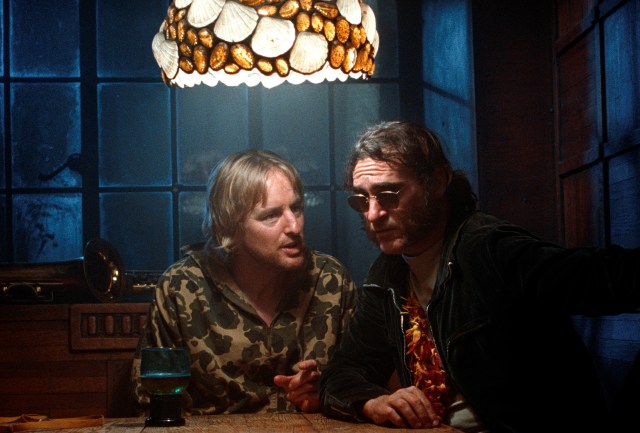 Owen Wilson and Joaquin Phoenix sleuth confusedly in 'Inherent Vice' (Warner Bros.)