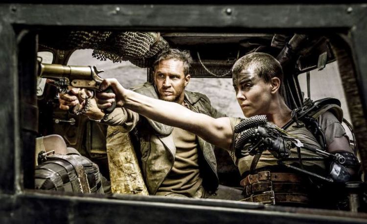 Tom Hardy and Charlize Theron fight the future (Warner Bros.)